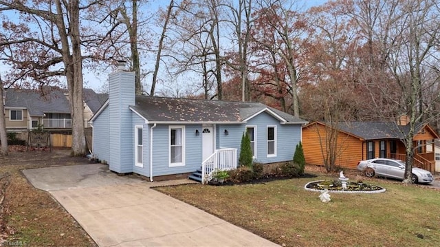 ranch-style home featuring a front yard