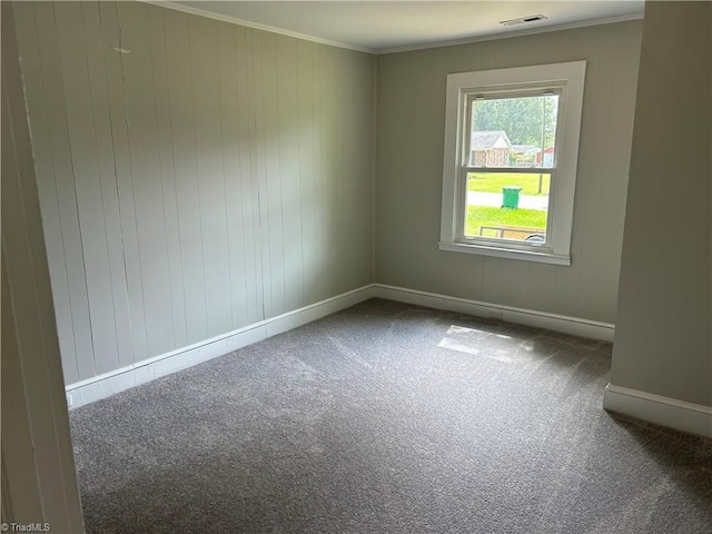 empty room with carpet and ornamental molding