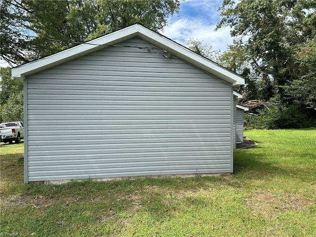 view of property exterior with a yard