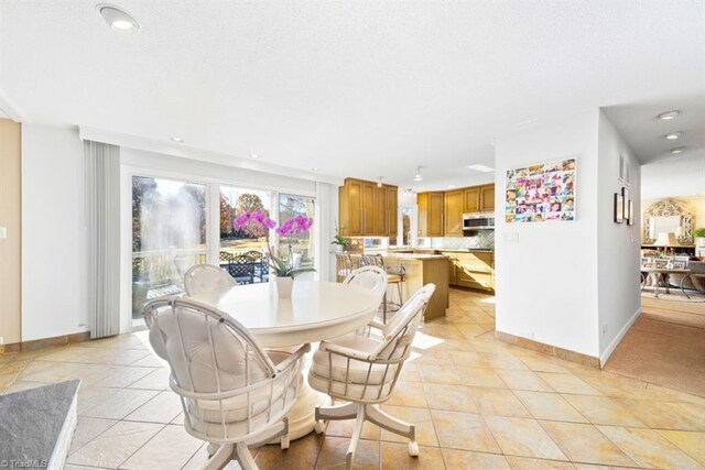 dining room with light tile patterned flooring