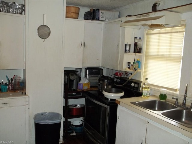 kitchen with white cabinetry, white electric range oven, and sink