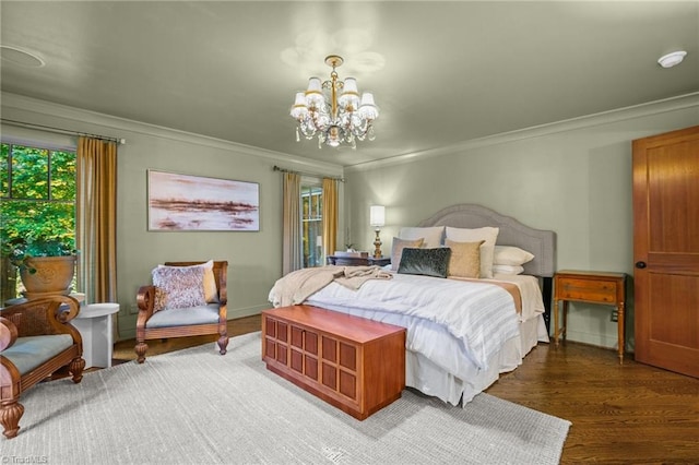 bedroom featuring crown molding, a notable chandelier, and dark hardwood / wood-style flooring