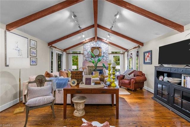 living room with hardwood / wood-style floors, vaulted ceiling, and rail lighting