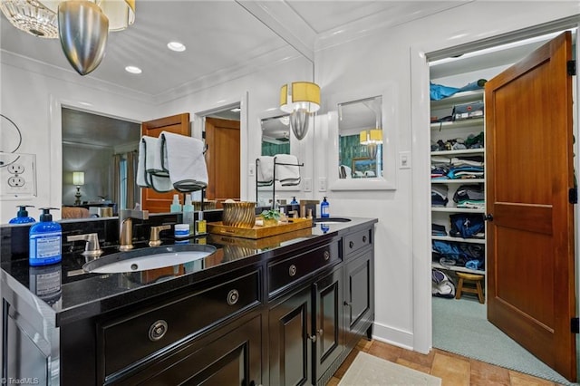 bathroom with vanity and crown molding