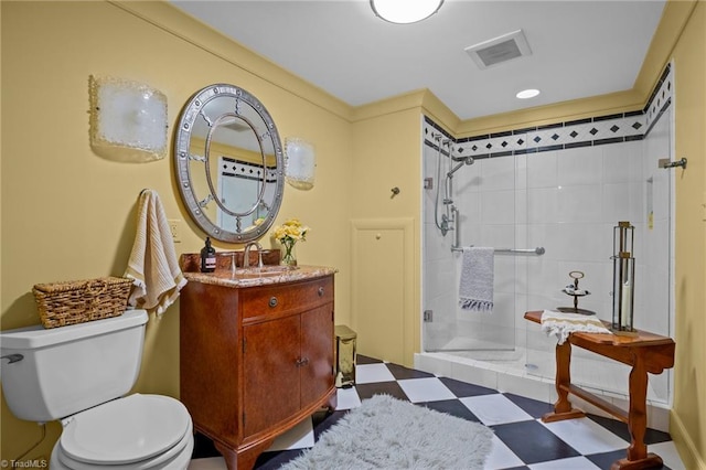 bathroom with vanity, toilet, and an enclosed shower