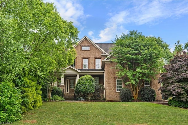 4803 Bluff Run Dr, Greensboro, NC 27455 - view of front of house with brick siding and a front lawn