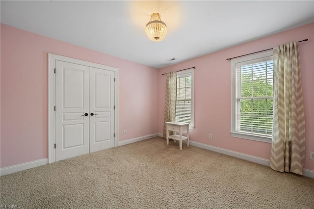 4803 Bluff Run Dr, Greensboro, NC 27455 - unfurnished bedroom with carpet floors, baseboards, and a closet