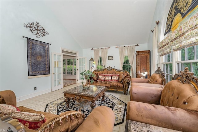 5002 Leadenhall Rd, Oak Ridge, NC 27310 - tiled living room featuring high vaulted ceiling, baseboards, and french doors
