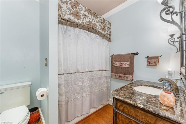 5002 Leadenhall Rd, Oak Ridge, NC 27310 - full bath featuring vanity, toilet, ornamental molding, wood finished floors, and baseboards