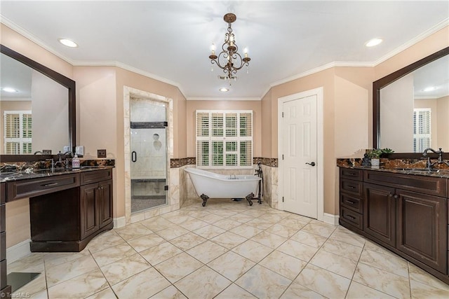 5002 Leadenhall Rd, Oak Ridge, NC 27310 - full bathroom featuring a stall shower, plenty of natural light, two vanities, recessed lighting, and ornamental molding