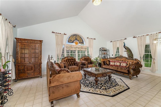 5002 Leadenhall Rd, Oak Ridge, NC 27310 - living room featuring high vaulted ceiling, light tile patterned floors, and healthy amount of natural light