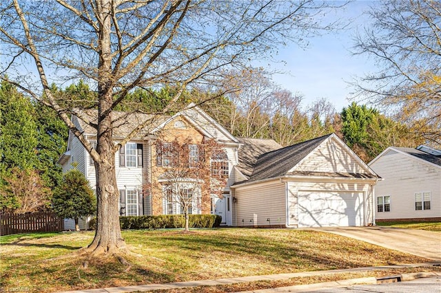 view of front property with a front yard and a garage