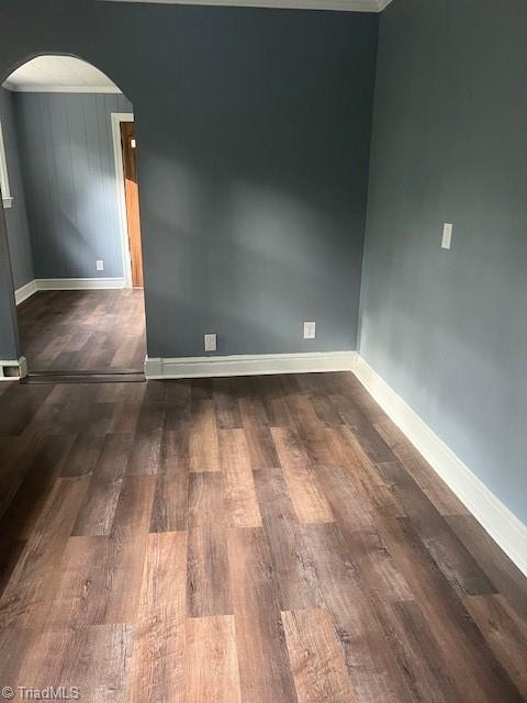 spare room featuring dark hardwood / wood-style flooring