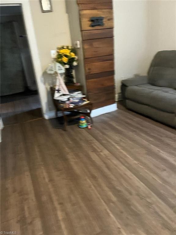 sitting room featuring wood-type flooring