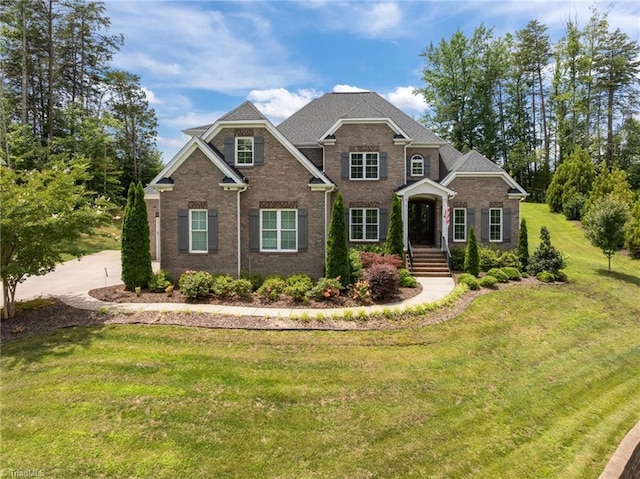 7823 Gatsby Pl, Greensboro, NC 27455 - view of front of property with a front lawn and brick siding