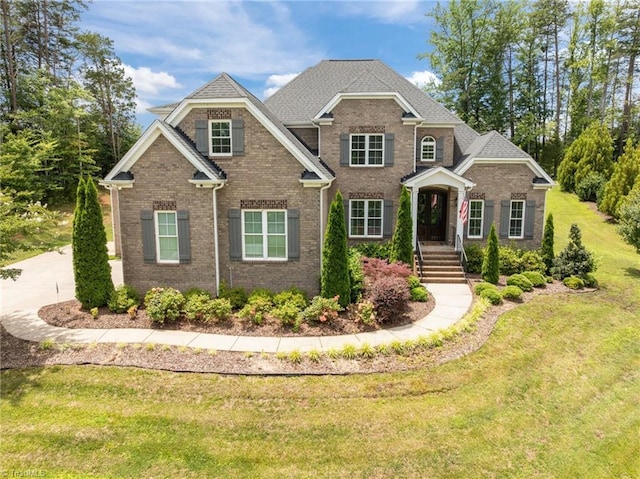 7823 Gatsby Pl, Greensboro, NC 27455 - view of front of property with brick siding and a front yard