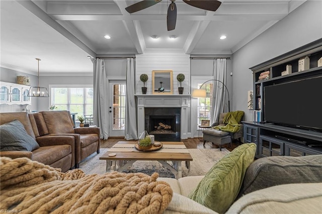 7823 Gatsby Pl, Greensboro, NC 27455 - living area with wood finished floors, coffered ceiling, a large fireplace, ceiling fan, and beamed ceiling
