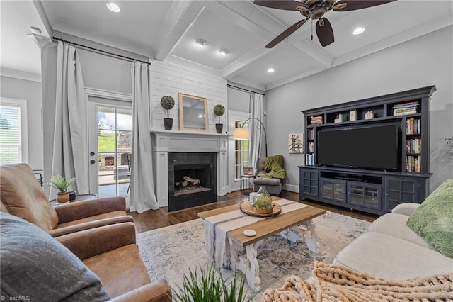 7823 Gatsby Pl, Greensboro, NC 27455 - living area featuring a ceiling fan, wood finished floors, a fireplace, beamed ceiling, and coffered ceiling