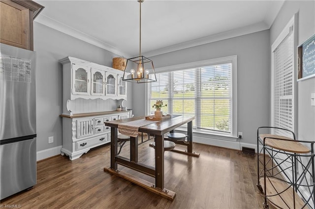 7823 Gatsby Pl, Greensboro, NC 27455 - dining room with a chandelier, dark wood-style floors, and ornamental molding