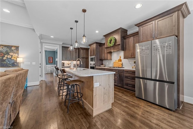 7823 Gatsby Pl, Greensboro, NC 27455 - kitchen with stainless steel appliances, dark wood-style flooring, backsplash, recessed lighting, and dark brown cabinetry