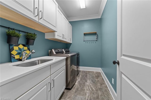 7823 Gatsby Pl, Greensboro, NC 27455 - laundry room with washing machine and dryer and cabinet space