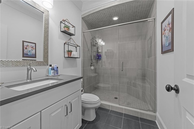 7823 Gatsby Pl, Greensboro, NC 27455 - bathroom with tile patterned flooring, vanity, and a stall shower