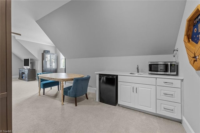 7823 Gatsby Pl, Greensboro, NC 27455 - interior space featuring light colored carpet and vaulted ceiling