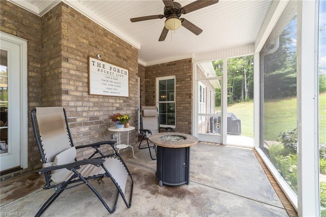7823 Gatsby Pl, Greensboro, NC 27455 - sunroom featuring an outdoor fire pit and ceiling fan
