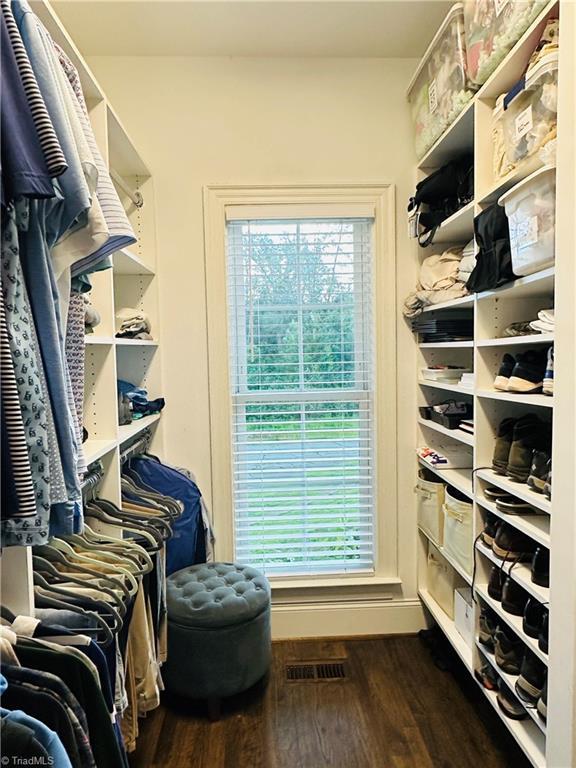 7823 Gatsby Pl, Greensboro, NC 27455 - walk in closet with dark wood-style floors