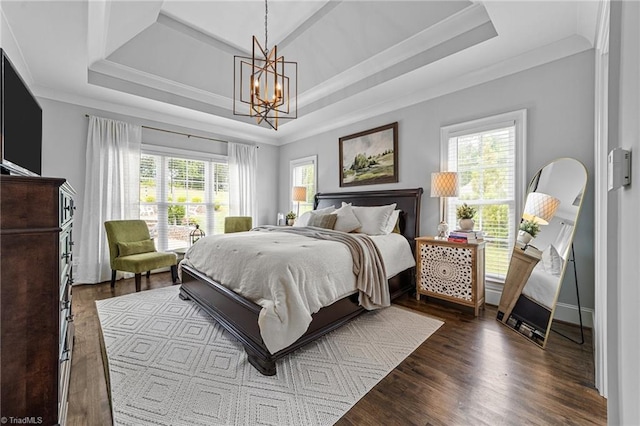 7823 Gatsby Pl, Greensboro, NC 27455 - bedroom featuring multiple windows, a raised ceiling, a chandelier, and ornamental molding