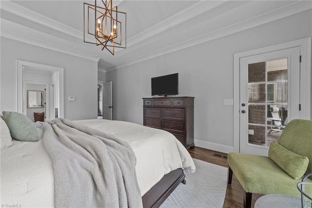 7823 Gatsby Pl, Greensboro, NC 27455 - bedroom with dark wood-style flooring, a chandelier, and crown molding
