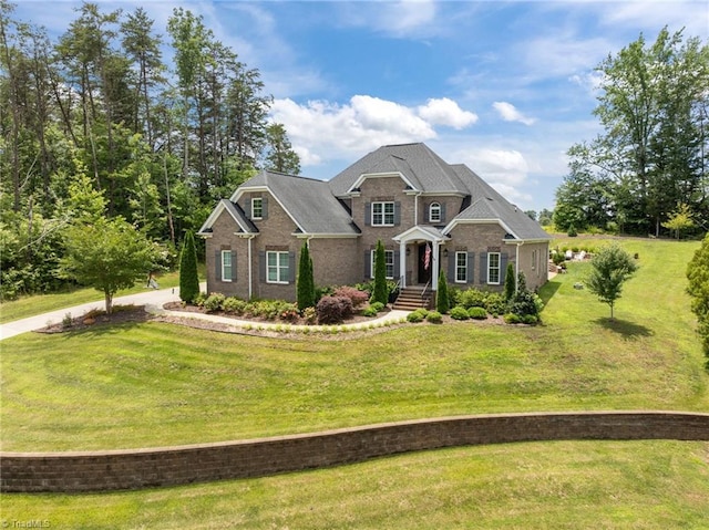 7823 Gatsby Pl, Greensboro, NC 27455 - traditional-style house with brick siding and a front lawn