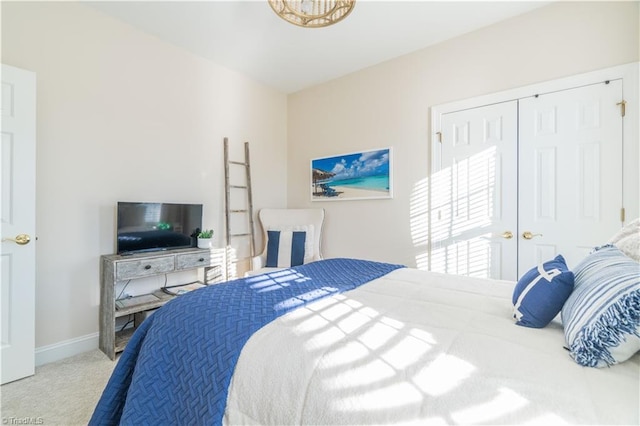 carpeted bedroom with a closet