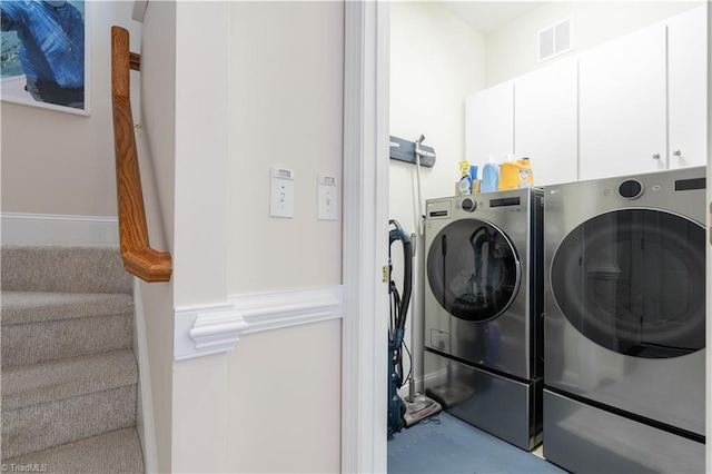 laundry area with cabinets and washer and dryer