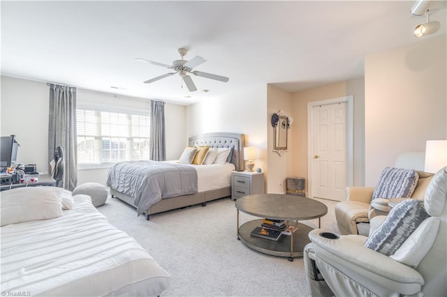 carpeted bedroom featuring ceiling fan