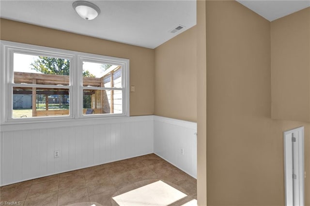 spare room with light tile patterned floors