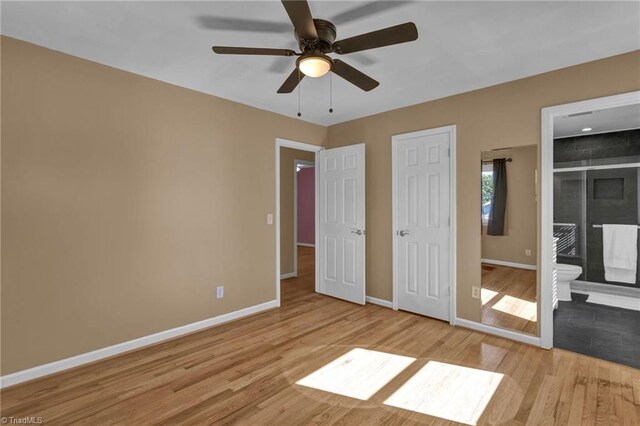 unfurnished bedroom with light hardwood / wood-style floors, connected bathroom, and ceiling fan