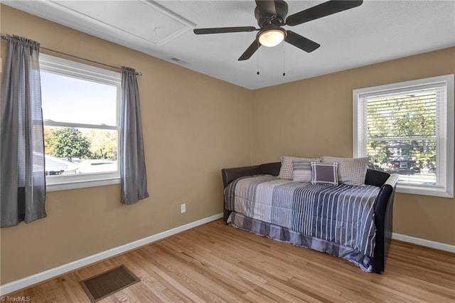 bedroom featuring light hardwood / wood-style flooring and ceiling fan