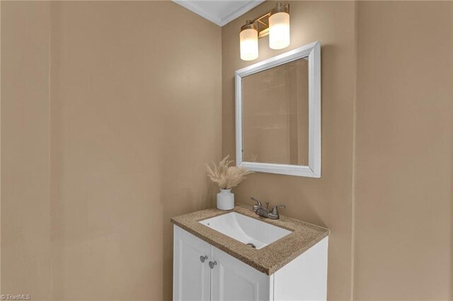 bathroom featuring vanity and ornamental molding