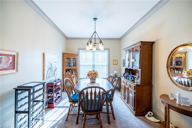 carpeted dining area with crown molding