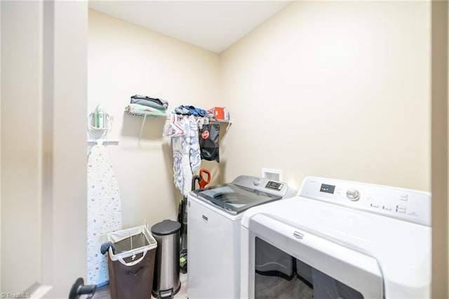 laundry room with washer and clothes dryer and laundry area