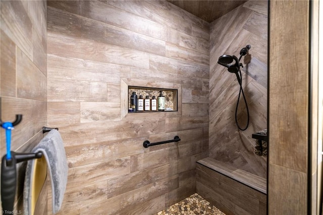 full bath featuring a tile shower