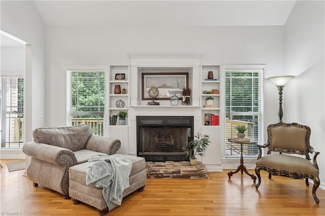 449 Wallburg High Point Rd, Winston-Salem, NC 27107 - living area with wood finished floors, plenty of natural light, and a fireplace with raised hearth
