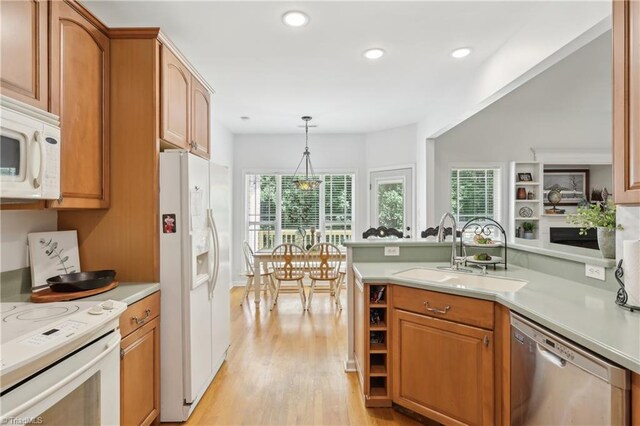 449 Wallburg High Point Rd, Winston-Salem, NC 27107 - kitchen with white appliances, a sink, light wood-style floors, light countertops, and recessed lighting