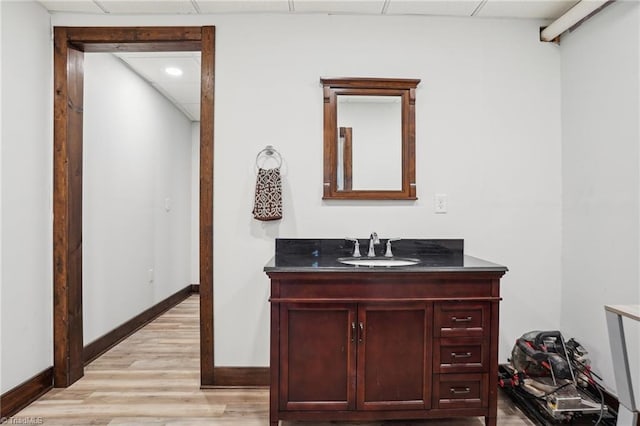 449 Wallburg High Point Rd, Winston-Salem, NC 27107 - bathroom featuring vanity, wood finished floors, baseboards, and a drop ceiling