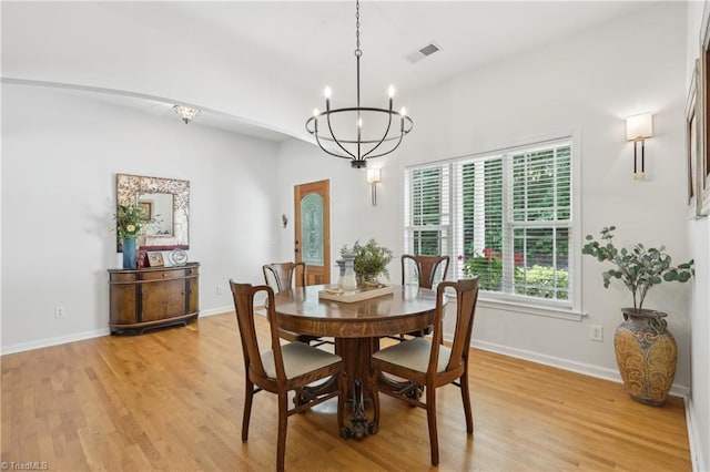 449 Wallburg High Point Rd, Winston-Salem, NC 27107 - dining space with a chandelier, light wood-style floors, and baseboards