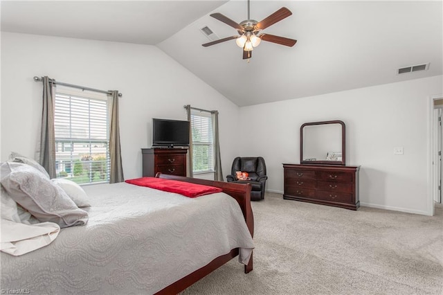 carpeted bedroom with a ceiling fan, baseboards, visible vents, and vaulted ceiling