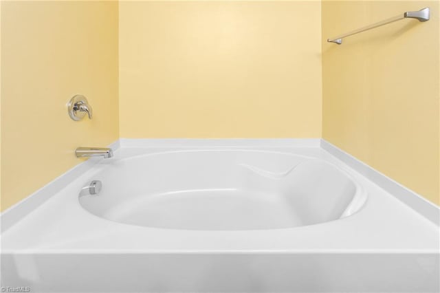 full bath with a washtub