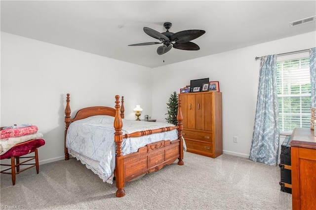 carpeted bedroom with ceiling fan, baseboards, and visible vents