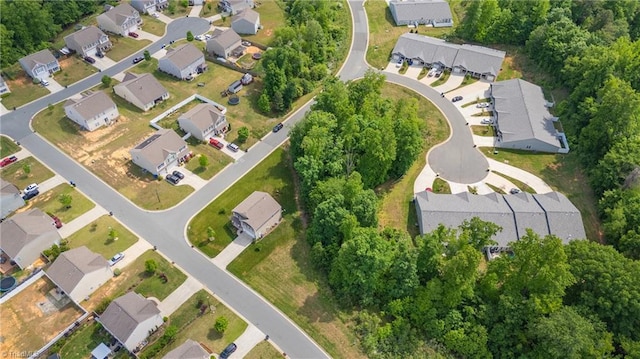 birds eye view of property with a residential view